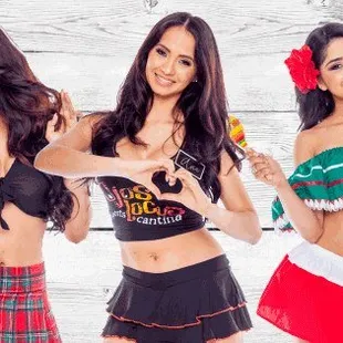 three women in christmas outfits