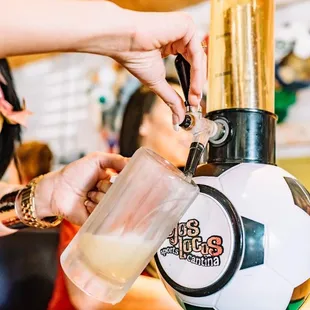 a person pouring a drink