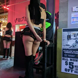 Cold drinks,  lots of TVs &amp;sports, and many girls in sexy outfits.