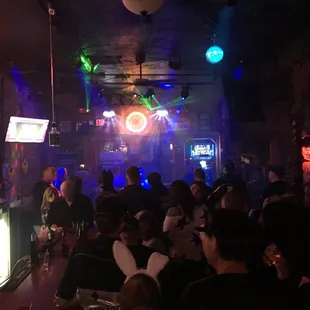 a group of people sitting at a bar