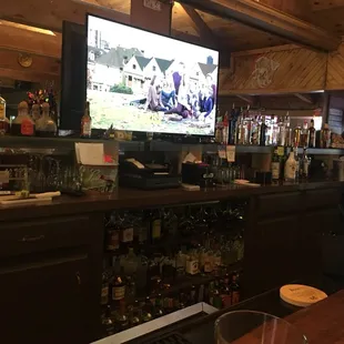 a bar with a large screen tv