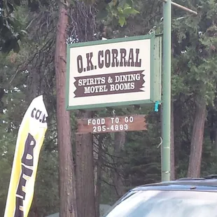 a car parked in front of a sign