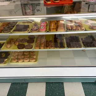 a display case filled with different types of donuts