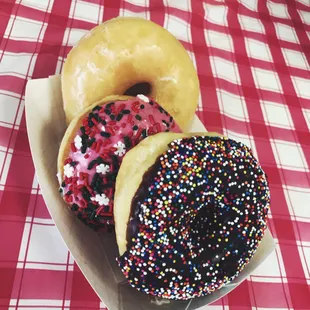 a box of three different flavored donuts