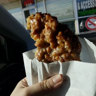 a hand holding a piece of food