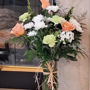 What my recipient received. No blue flowers, too much filler, sloppy bow in vertical position.