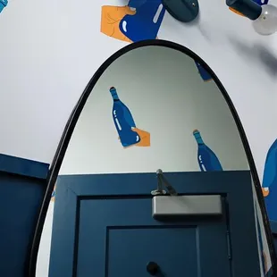 Delightful wine themed stencils in the restroom