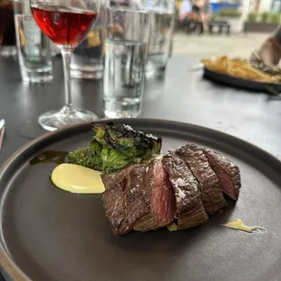 Teres Major Steak with Romano beans, charred greens, roasted garlic aioli, and sauce verde