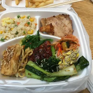 a meal in a styrofoam container