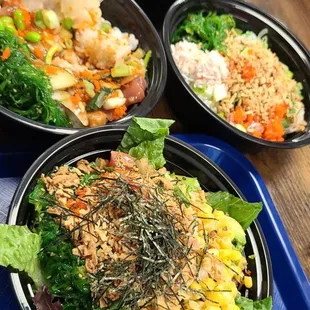  three bowls of food on a table