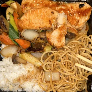 Hibachi Salmon Meal comes with tossed Salar and a cup of miso soup.