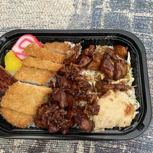 Mini combo tonkatsu and char siu chx. All bentos comes with luncheon meat, fish cake, takuan, mahi mahi, rice and a bed of cabbage. Yummy!