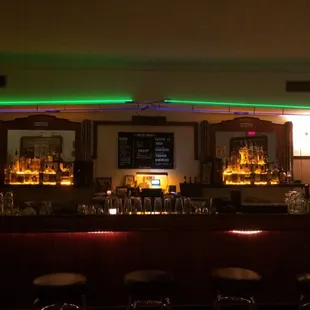 View of the bar from the booths. Check out that cool vintage neon!