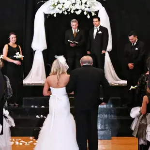 OKC Wedding Officiants Pastor John T Snelson V performing a Great Gatsby wedding at Farmers Public Market in Oklahoma City.
