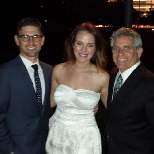 OKC Wedding Officiants Pastor John T Snelson V performing a intimate ceremony in the fore ground of the Devon Tower.