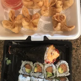 From top to bottom: Crab Rangoon, spicy tuna (hand) roll, and Salmon avocado roll