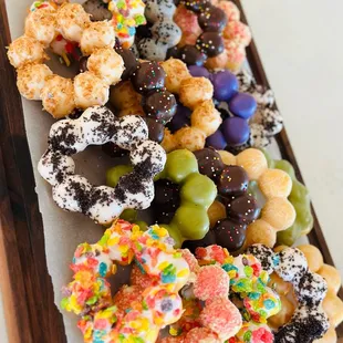 a variety of donuts on a cutting board