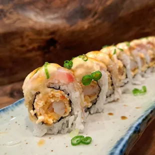 White Dragon roll - spicy crab and deep fried shrimp topped with escolar and albacore