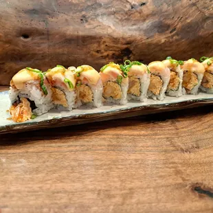 White Dragon roll - spicy crab and deep fried shrimp topped with escolar and albacore