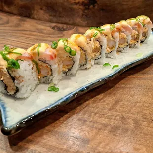 White Dragon roll - spicy crab and deep fried shrimp topped with escolar and albacore