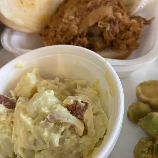 Potato salad, pulled pork sandwich
