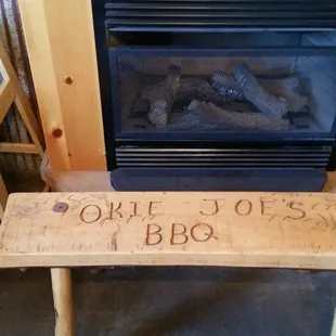 a wooden bench and a fire place