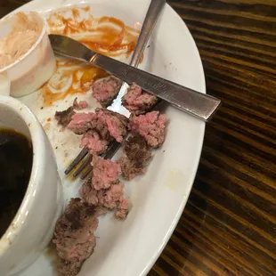 a plate of food and a cup of coffee