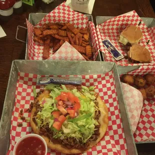 The whole spread. Taco salad, 2 sliders, sweet potato fries, hush puppies
