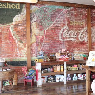 a coca cola sign on the wall