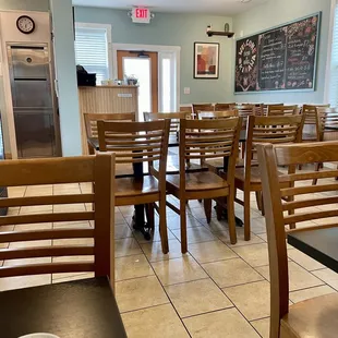 Interior of restaurant from back looking towards front entrance. Clean, decent number of tables for how small a size this place is