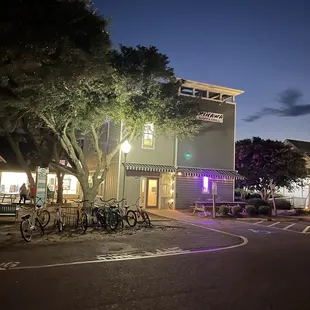 Evening shot of building that houses Okinawa Sushi restaurant - in Timbuck II Shopping Village in Corolla near Food Lion