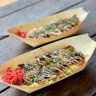 two plates of food on a wooden table