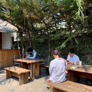 two men sitting at picnic tables