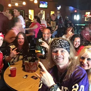 a group of people at a sports bar