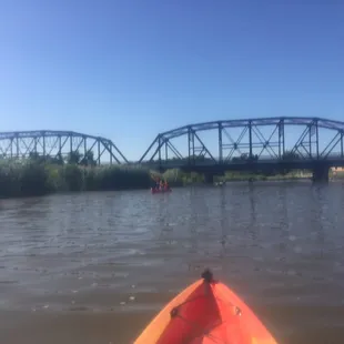 Scenic old bridge. Definitely go under this, and you'll find some beautiful native grasses, reeds, etc.
