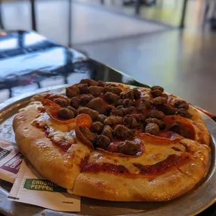 a pizza with meatballs and pepperoni