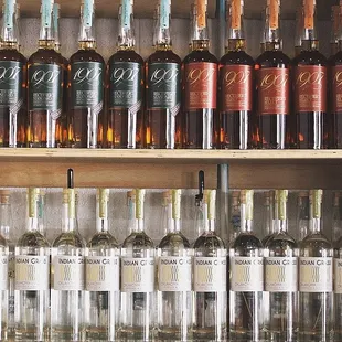 a shelf of liquor bottles