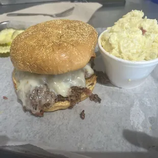 &apos;The Q&apos; brisket sandwich. Potato salad