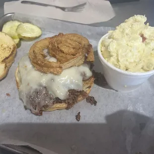 The Q, has onion rings on the sandwich