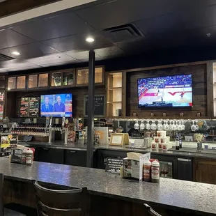 a bar with a television in the background