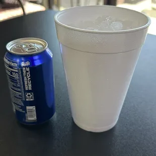 soda can with large cup of ice