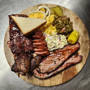 a plate of meat and sides