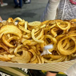 A loaf of curly fries, pre salt &amp; ketchup..they hit the spot!