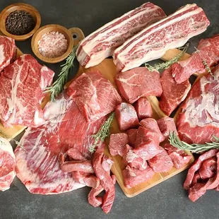a variety of meat on a cutting board