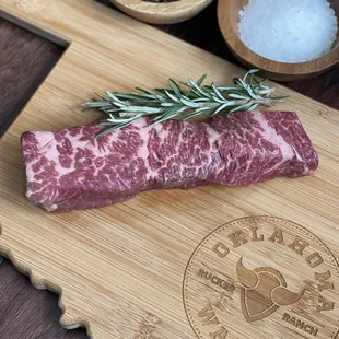 a raw wagyu on a cutting board