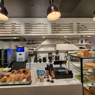 a counter with a variety of pastries