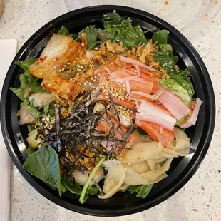 Assorted Veggies bowl with salmon, yellowtail, crab, and shrimp.