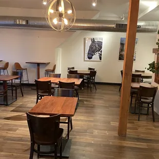 a dining area with tables and chairs