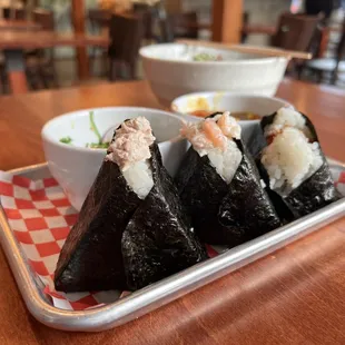 a plate of sushi and a bowl of soup