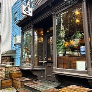 a storefront with a clock on it